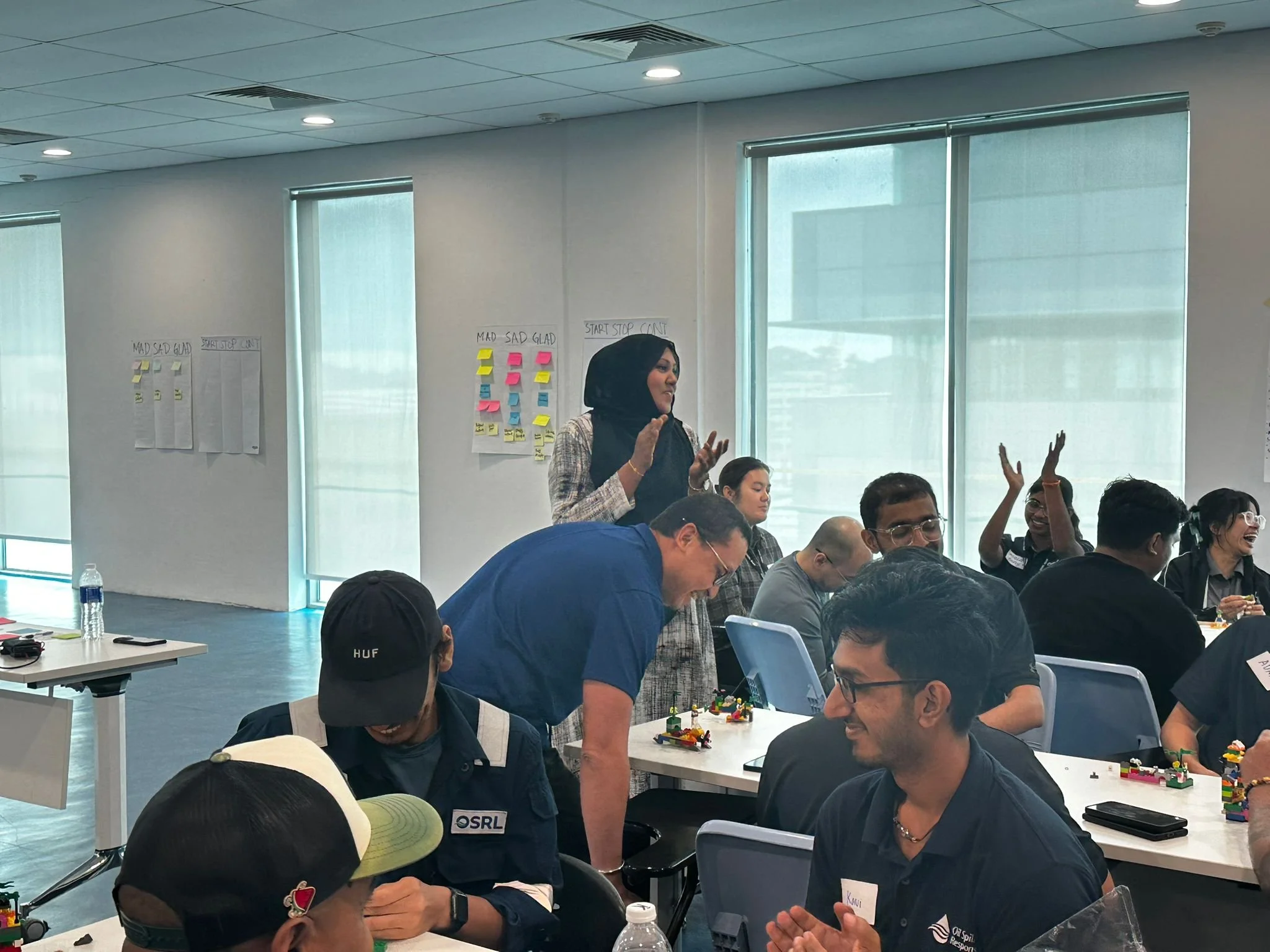 Aishah facilitating a large LEGO Serious Play workshop